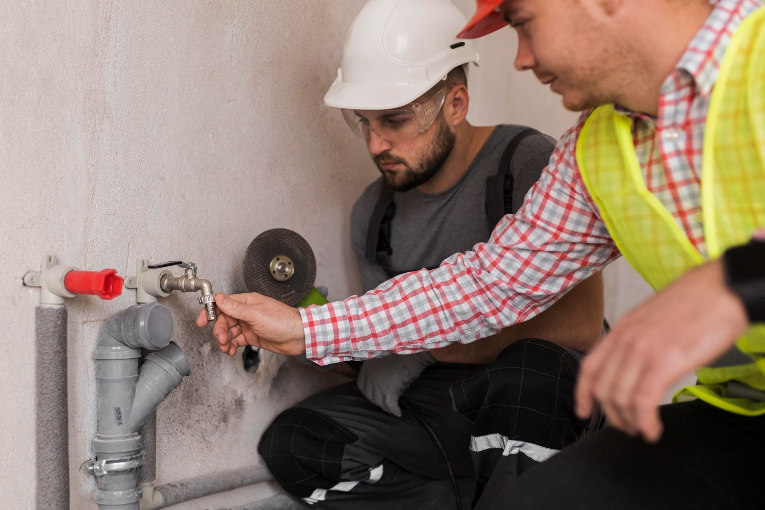 technician inspecting gas pipe for gas leak
