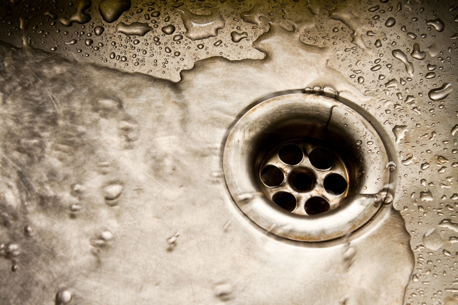 water flowing down sink drain